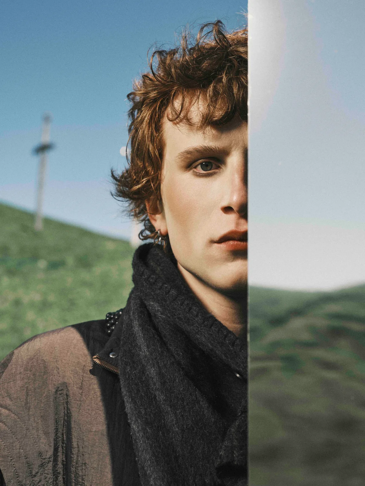 Cinematic still from RESH fashion campaign — wide frame with model