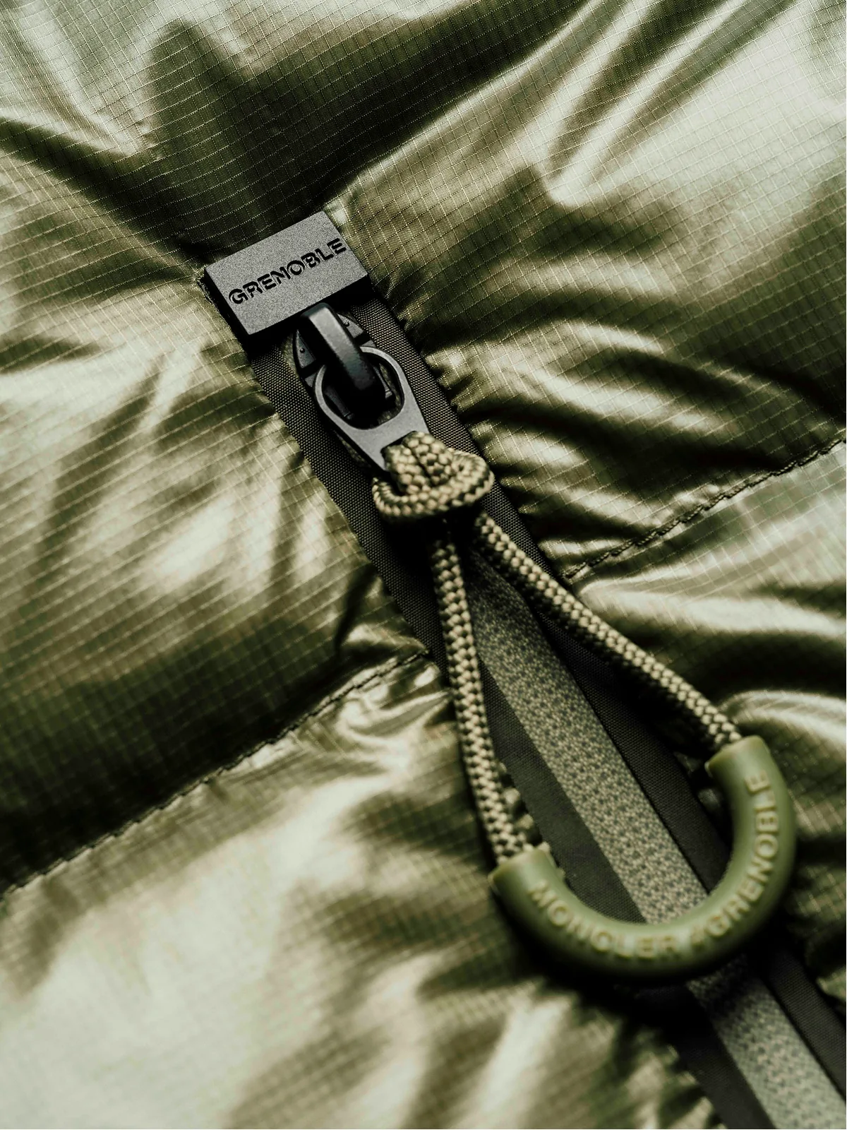 Fashion still from RESH Moncler Grenoble campaign — close look green jacket